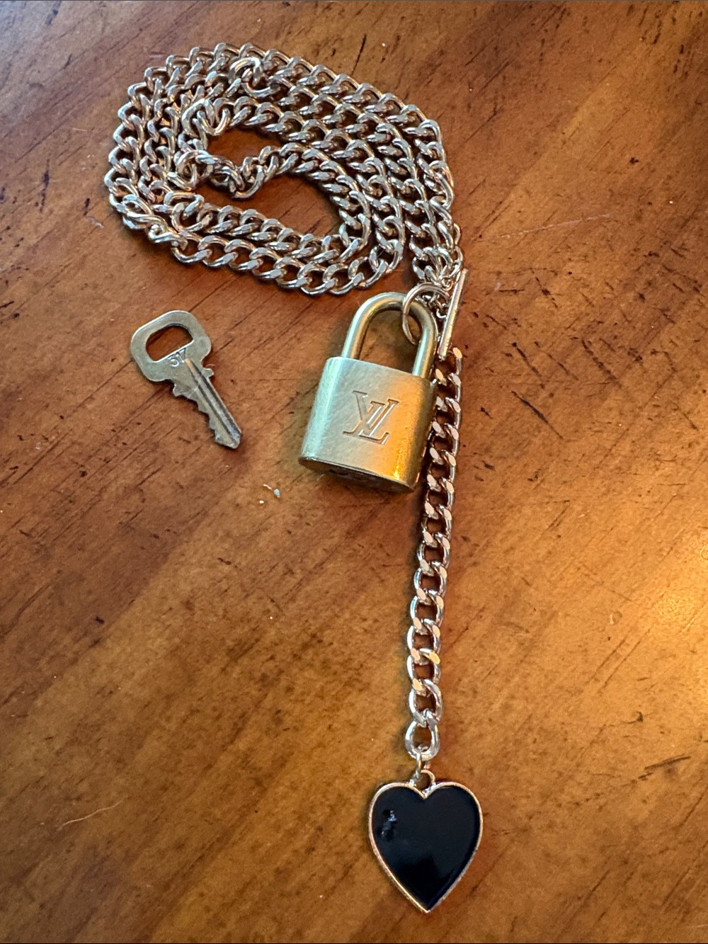 Louis Vuitton Gold-tone Padlock On unbranded chain with Black Heart Charm